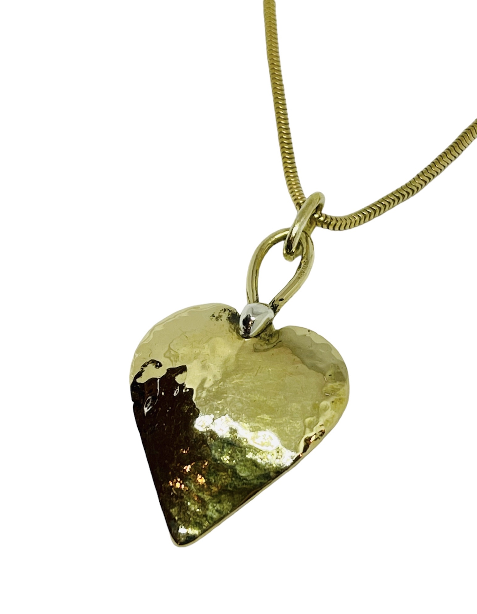 Small hammered yellow-gold heart pendant on a yellow-gold snake chain with a white-gold bail